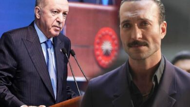 Turkish President Erdoğan speaks at a podium with microphones; a man with a mustache stands in the foreground.
