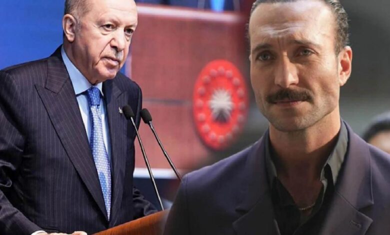 Turkish President Erdoğan speaks at a podium with microphones; a man with a mustache stands in the foreground.