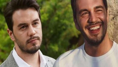 Two men outdoors, one with a thoughtful expression on the left and a man smiling broadly on the right near a tree.