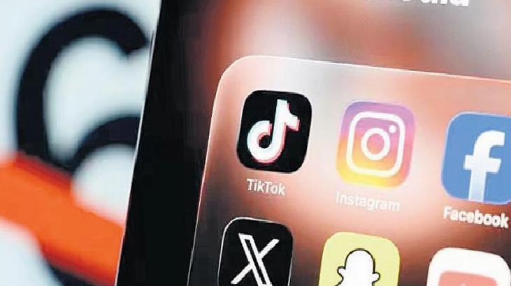Close-up of a smartphone screen showing social media app icons: TikTok, Instagram, Facebook, Snapchat, and X (Twitter).