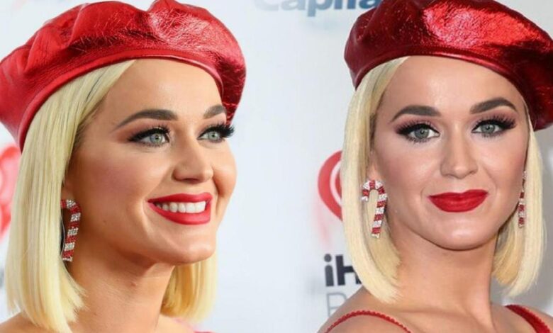 Two women with platinum blonde bob hair, wearing red berets and bold red lipstick, smiling at a backdrop.