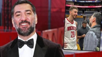 Man in a black tuxedo and bow tie smiles on a red carpet; an inset shows a Rockets player wearing jersey 28 talking to a man in a gray jacket on a court backdrop.