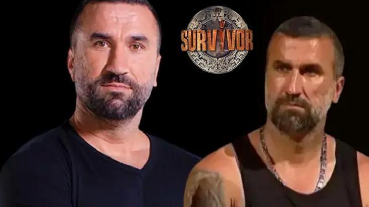 Two men with serious expressions stand against a black background, a Survivor logo between them, suggesting a promotional image for the TV show Survivor.