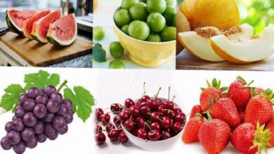 Collage of fresh fruits: watermelon wedges on a cutting board, a bowl of limes, cantaloupe slices, a bunch of purple grapes, cherries in a bowl, and ripe strawberries.